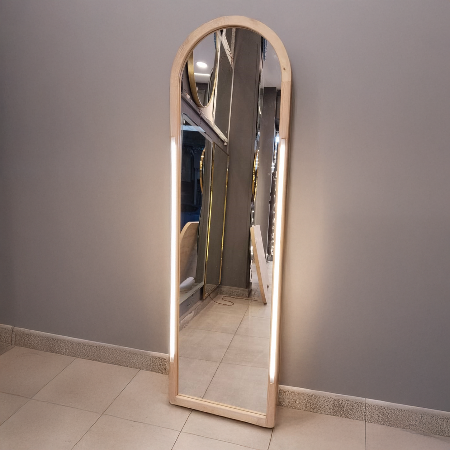 Tall arched mirror with wooden frame